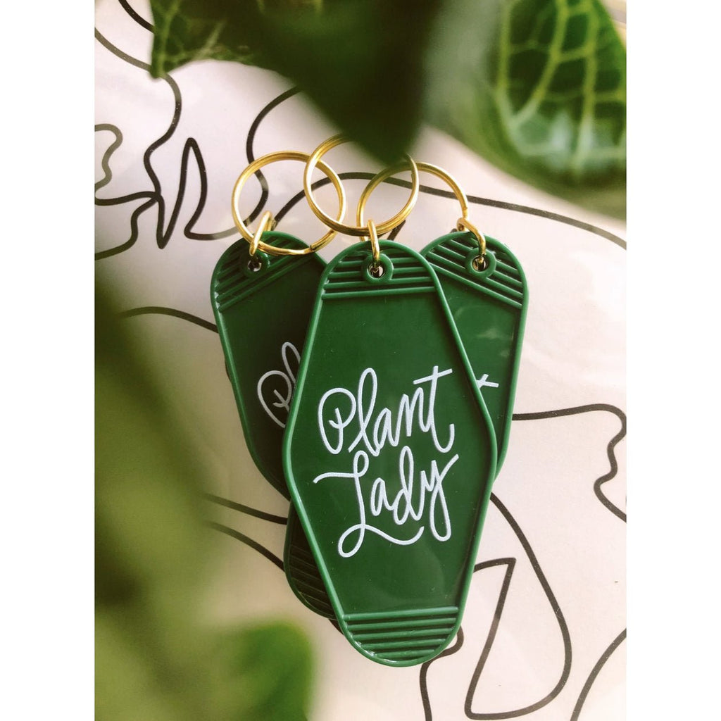 green plant lady retro motel keychain with white letters
