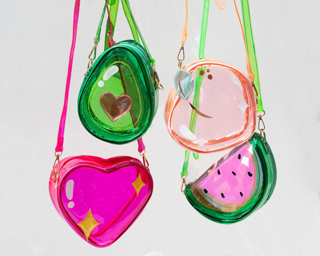 Four colorful clear bags on a light gray background