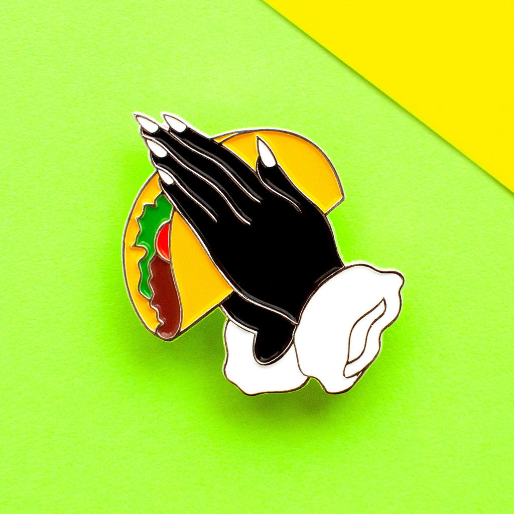 praying hands with a taco enamel pin