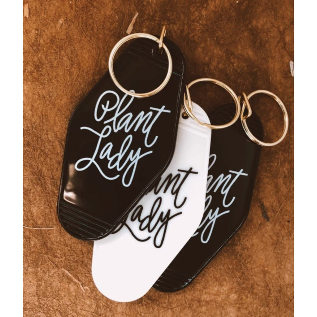 black and white plant lady retro motel keychain with white letters