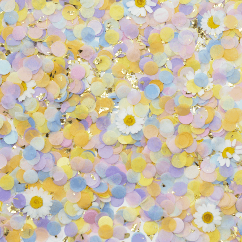 pink blue orange and yellow confetti with gold flakes and dried daisies